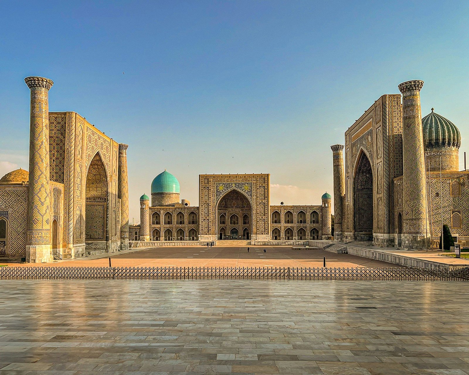 Traveler overlooking Registan Square in Samarkand — Uzbekistan travel services
